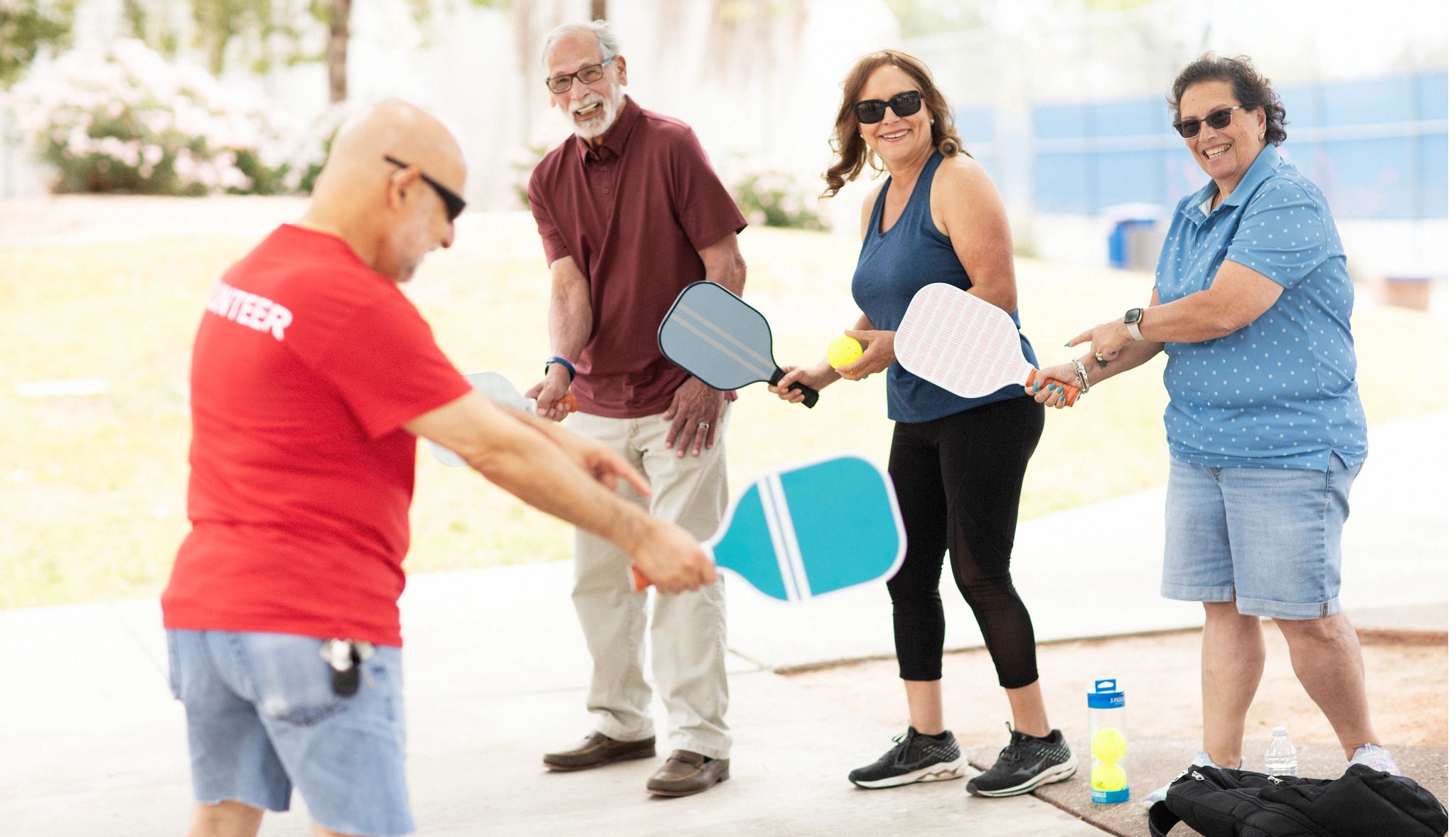 Group learning to play pickleball Group learning to play pickleball